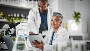 Two doctors looking at a clipboard